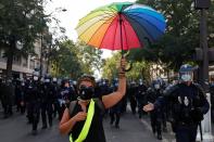 Protestors attend a demonstration of the yellow vests movement in Paris