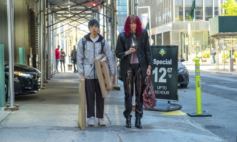 This image released by A24 Films shows Julio Torres, left, and Tilda Swinton in a scene from "Problemista." (Jon Pack/A24 via AP)