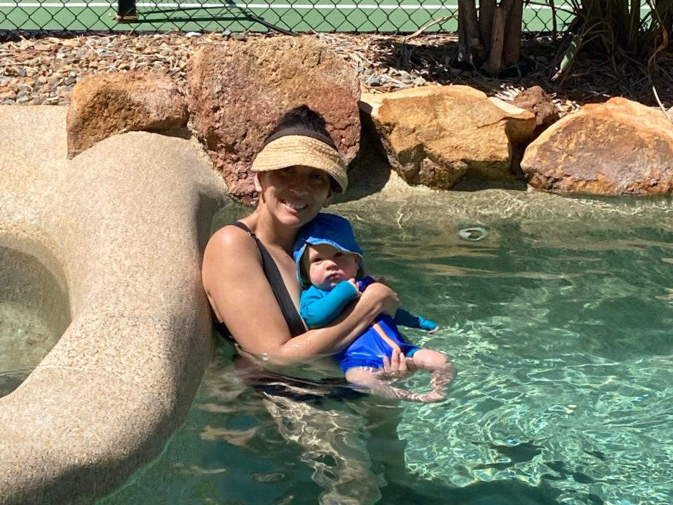 MaryLou Costa and her child in a pool