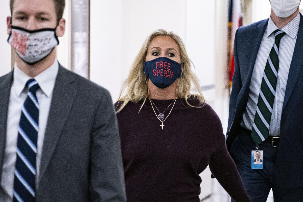 Rep. Marjorie Taylor Green, R-Ga., walks back to her office after speaking on the House floor Thursday. (Al Drago/Bloomberg via Getty Images)