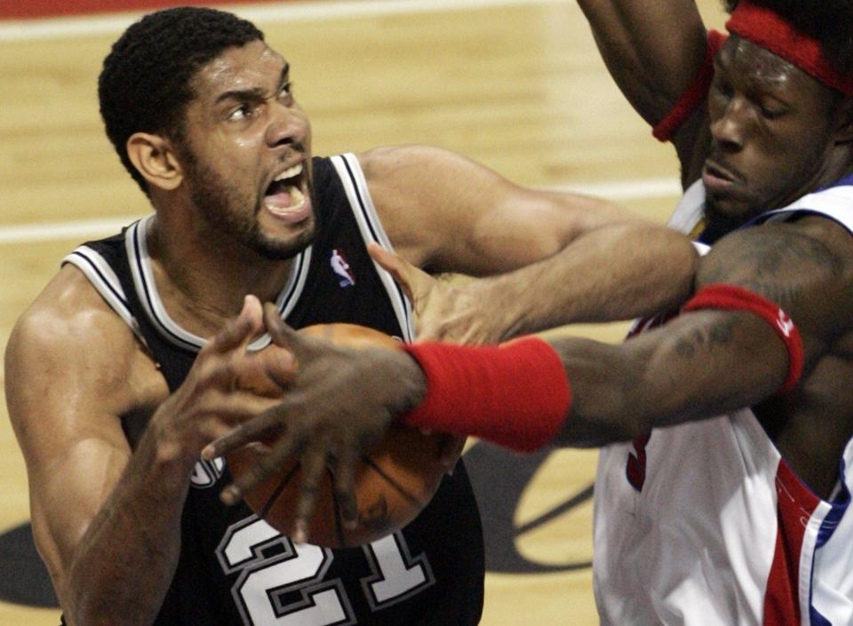 Pistons' Ben Wallace defends Spurs' Tim Duncan during the second quarter in Game 5 of the NBA Finals, Sunday, June 19, 2005 at the Palace of Auburn Hills.