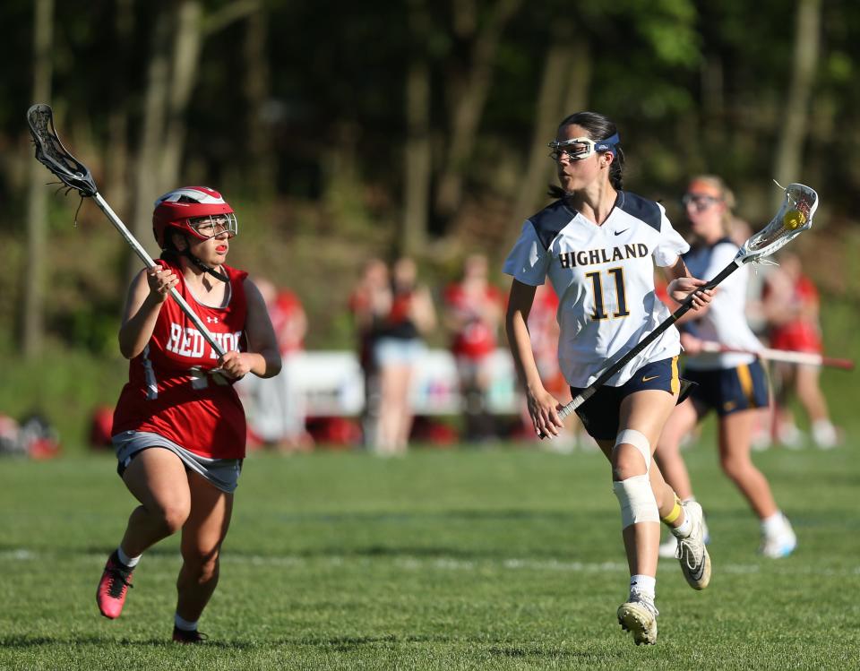 Highland's Caitlin Becker runs up field in transition against Red Hook during a May 8, 2024 girls lacrosse game.