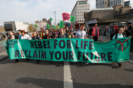 Climate change activists attend the Extinction Rebellion protest at Waterloo Bridge in London, Britain April 18, 2019. REUTERS/Peter Nicholls