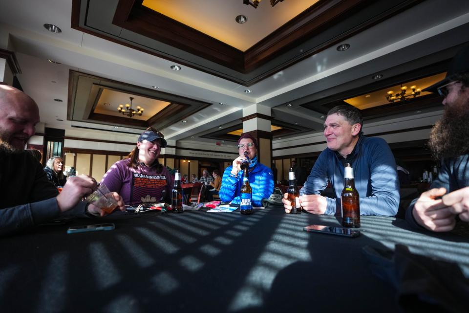 Josh Crouse, left, Michelle Kraber, Mary Lafferty, Jeff Kraber and Aaron Lafferty enjoy a few breakfast beers at the Hotel Pattee before taking off for the 46th Annual BRR Ride on Saturday, Feb. 4, 2023.