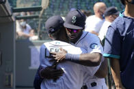 Seattle Mariners' Kyle Lewis, left, is greeted by Taylor Trammell before a baseball game Tuesday, April 20, 2021, in Seattle. (AP Photo/Ted S. Warren)