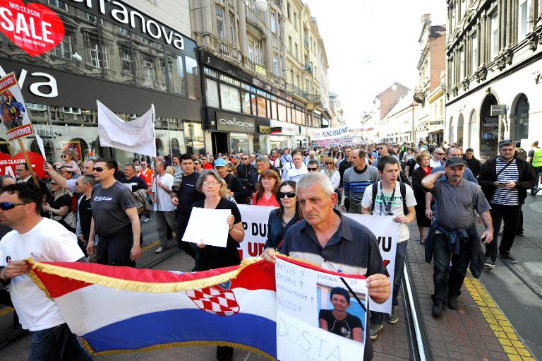 Holders of Swiss franc mortgages and their supporters take part in a march in Zagreb to protest the government and central bank's failure to find a lasting solution to the issue, April 25, 2015