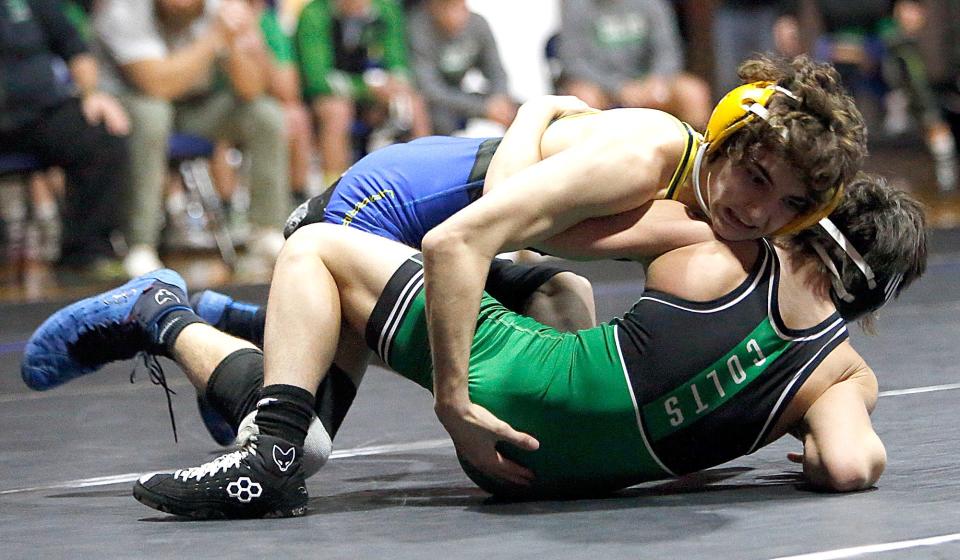Ontario High School’s Aiden Ohl wrestles Clear Fork High School’s Hezekiah Molina during their 106lbs match during the dual match Friday, Feb. 2, 2024 at Ontario High School. TOM E. PUSKAR/MANSFIELD NEWS JOURNAL
