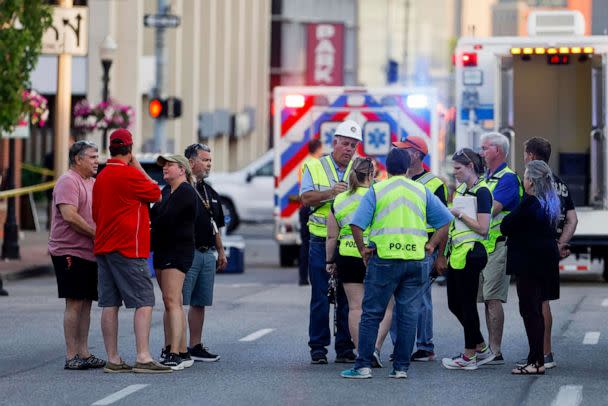 PHOTO: Officials gather on Harrison Street as emergency crews work the scene of a partial building collapse on the 300 block of Main Street, on May 28, 2023, in Davenport, Iowa. (Nikos Frazier/Quad City Times via AP)