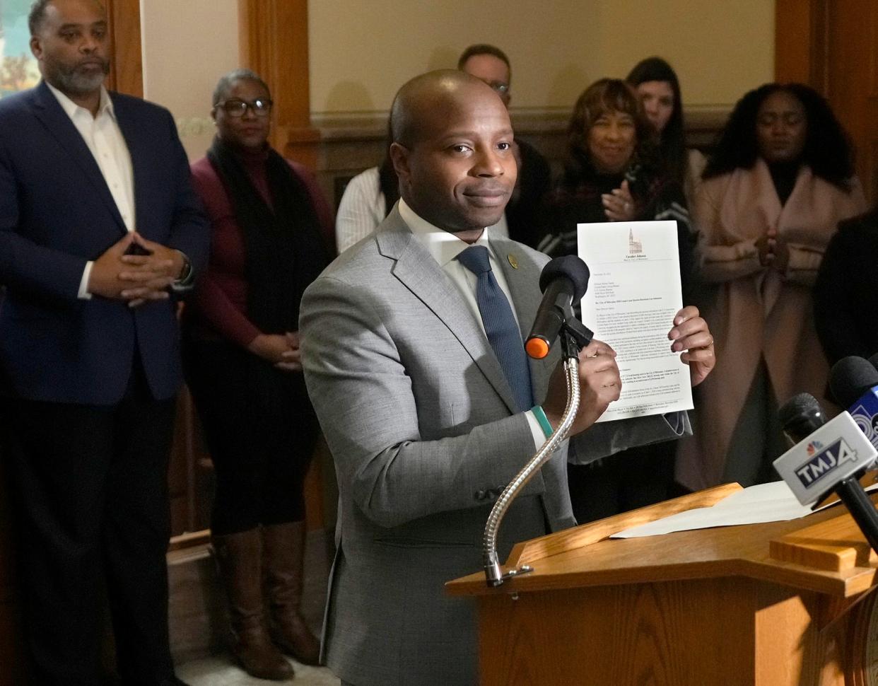 Mayor Cavalier Johnson holds up a letter he signed to U.S. Census Bureau Director Robert Santos challenging the City of Milwaukee's 2020 Census count during a new conference at City Hall in Milwaukee on Tuesday, Dec. 20, 2022. Milwaukee officials long skeptical of the 2020 U.S. Census tally are formally challenging the finding that the city lost nearly 3% of its population in the last 10 years, leaving it at its lowest population since 1930.