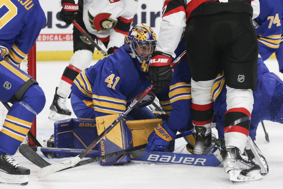 Buffalo Sabres goaltender Craig Anderson (41) blocks a shot during the second period of the team's NHL hockey game against the Ottawa Senators on Thursday, Oct. 13, 2022, in Buffalo, N.Y. (AP Photo/Joshua Bessex)