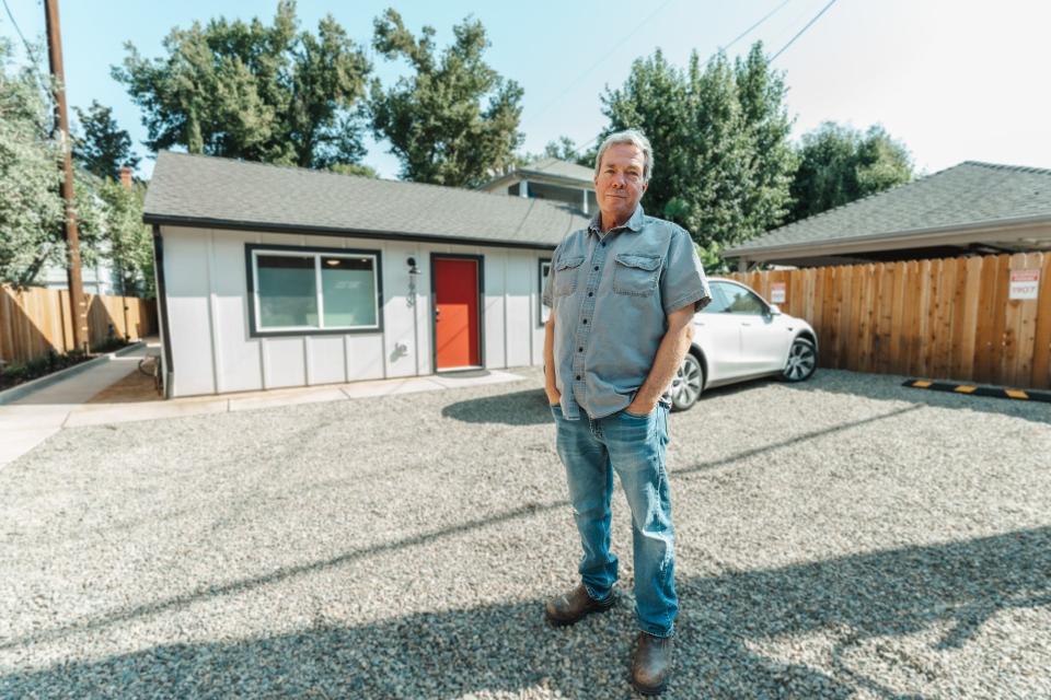 George Warren in front of his ADU.