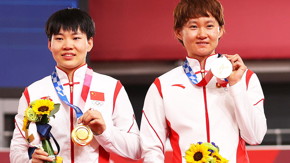 Shanju Bao and Tianshi Zhong, pictured here after winning gold in the women's sprint at the Tokyo Olympics.