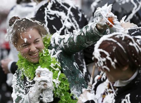 Students from St Andrews University are covered in foam as they take part in the traditional 'Raisin Weekend' in the Lower College Lawn, at St Andrews in Scotland, Britain October 17, 2016. REUTERS/Russell Cheyne