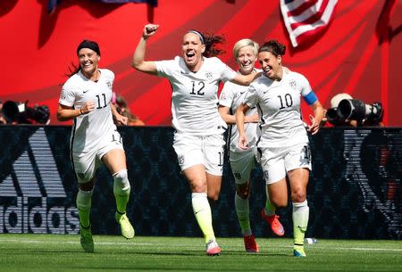 United States midfielder Carli Lloyd (10) celebrates with teammates after scoring against Japan during the first half of the final of the FIFA 2015 Women's World Cup in Vancouver July 5, 2015. Mandatory Credit: Michael Chow-USA TODAY Sports