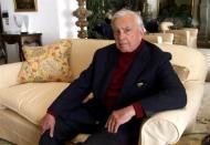 U.S. author Gore Vidal poses at his home in Ravello, southern Italy May 9, 2001. Leading author Gore Vidal defended his decision to witness the execution of [Timothy McVeigh] and said he shared the Oklaoma City bomber's view that government had run amok in America. Vidal, whose novels include " Burr " and " Lincoln ", said in a round of television interviews he was dreading watching McVeigh's execution on May 16 in a prison in Terre Haute, Indiana, but he had accepted his invitation to attend.