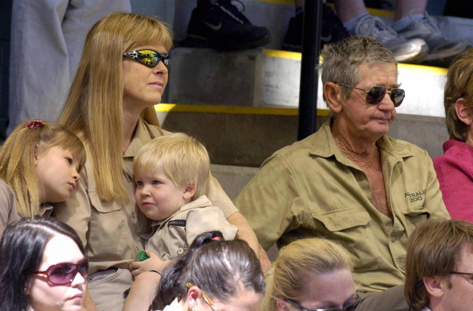 Terri Irwin sits with daughter Bindi, son Robert and Steve's father Bob at Steve's memorial service.