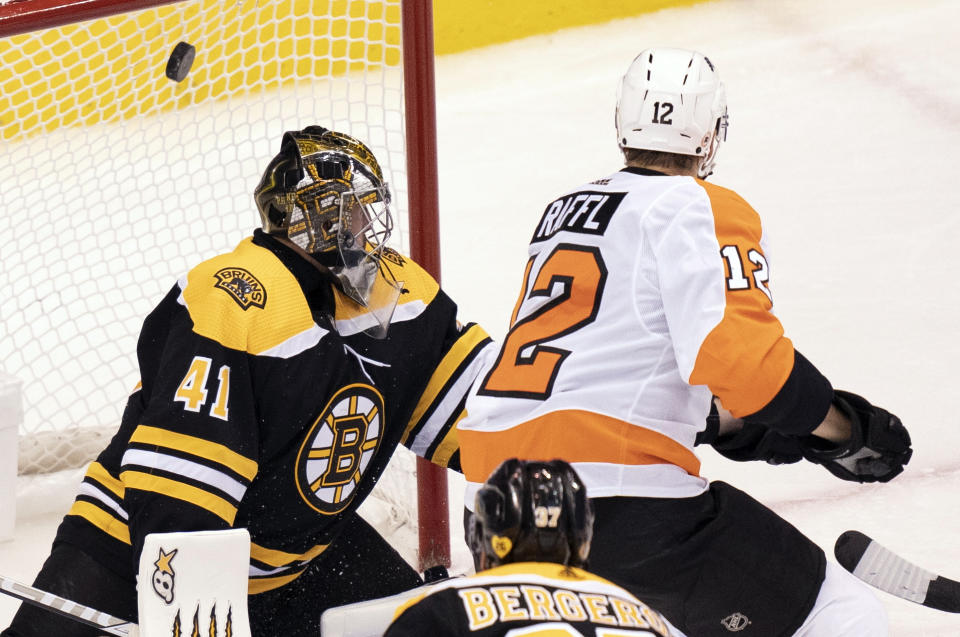 Philadelphia Flyers left wing Michael Raffl (12) scores against Boston Bruins goaltender Jaroslav Halak (41) during second-period NHL hockey playoff action in Toronto, Sunday, Aug. 2, 2020. (Frank Gunn/The Canadian Press via AP)