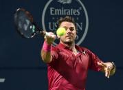 Jul 26, 2016; Toronto, Ontario, Canada; Stan Wawrinka of Switzerland hits a shot against Mikhail Youzhny of Russia on day two of the Rogers Cup tennis tournament at Aviva Centre. Mandatory Credit: Dan Hamilton-USA TODAY Sports