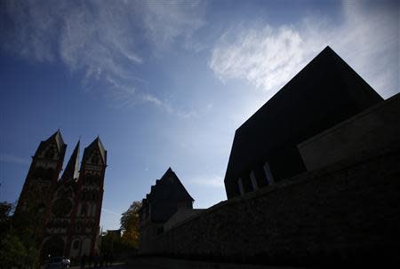 General view of the ensemble of the bishop's residence with the bishop's private chapel (R) and Limburg Cathedral (L) in Limburg October 14, 2013. REUTERS/Kai Pfaffenbach