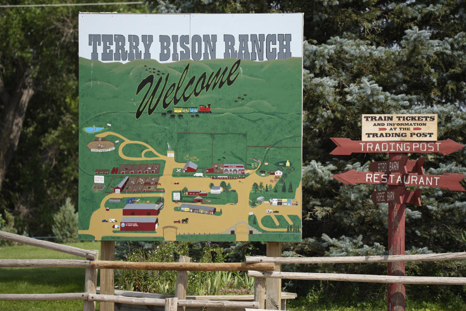 In this Monday, July 26, 2021, photograph, the sign to welcome visitors to the Terry Bison Ranch stands on the property south of Cheyenne, Wyo. Figures released this month show that population growth continues unabated in the South and West, even as temperatures rise and droughts become more common. (AP Photo/David Zalubowski)