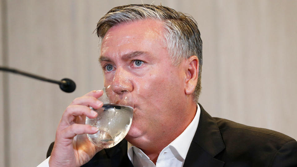 Collingwood president Eddie McGuire is seen here taking a drink during a press conference.