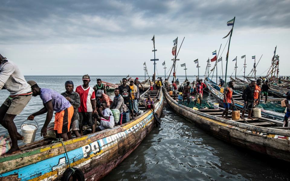 Fishermen landing their catch, Tombo Port, Sierra Leone - Simon Townsley/The Telegraph