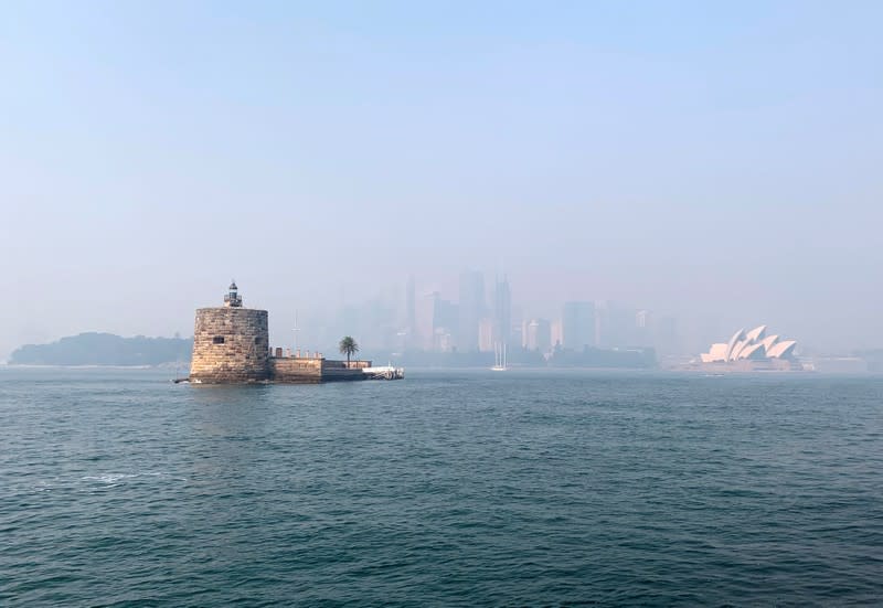 Fort Denison is seen as haze from the ongoing bushfires covers the city skyline and the Sydney Opera House in the background, in Sydney, Australia