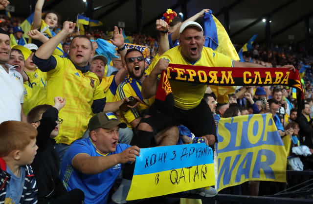 Ukraine fans are pictured here celebrating their side's victory over Scotland at Hampden Park. 