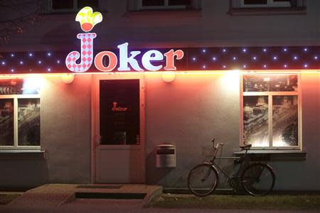 A bicycle is parked near a gambling club in Valka October 25, 2013. REUTERS/Ints Kalnins