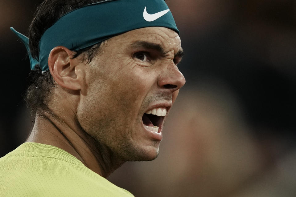 Spain's Rafael Nadal reacts after missing a point as he plays Serbia's Novak Djokovic during their quarterfinal match of the French Open tennis tournament at the Roland Garros stadium Tuesday, May 31, 2022 in Paris. (AP Photo/Thibault Camus)