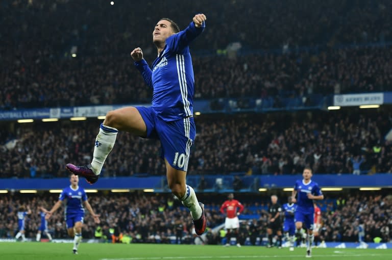 Chelsea's midfielder Eden Hazard celebrates after scoring their third goal on October 23, 2016