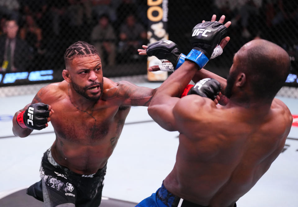 LAS VEGAS, NEVADA – FEBRUARY 10: (L-R) Michael Johnson punches Darrius Flowers in a lightweight fight during the UFC Fight Night event at UFC APEX on February 10, 2024 in Las Vegas, Nevada. (Photo by Jeff Bottari/Zuffa LLC via Getty Images)