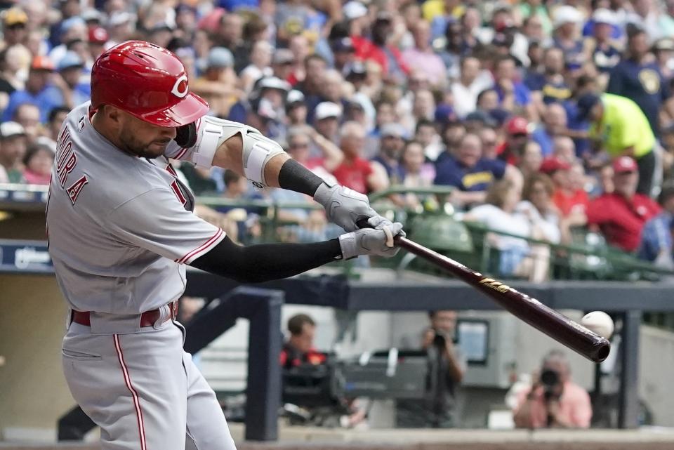 Cincinnati Reds' Albert Almora Jr. hits an RBI-double during the second inning of a baseball game against the Milwaukee Brewers, Saturday, Aug. 6, 2022, in Milwaukee. (AP Photo/Morry Gash)