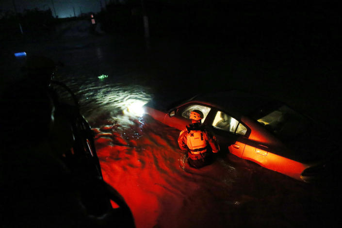 <p>A rescue team from the local emergency management agency inspects flooded areas after the passing of Hurricane Irma on Sept. 6, 2017 in Fajardo, Puerto Rico. (Photo: Jose Jimenez/Getty Images) </p>