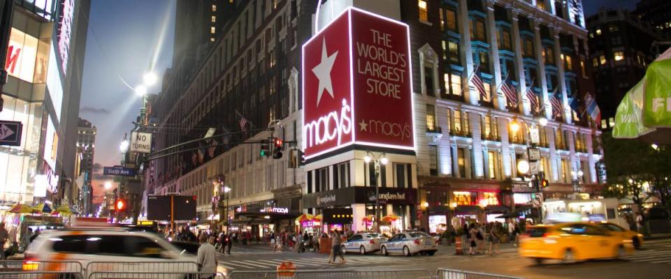 Macy's store exterior at night.