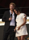 Prince Harry, the Duke of Sussex, left, and Meghan, the Duchess of Sussex speak at Global Citizen Live in Central Park on Saturday, Sept. 25, 2021, in New York. (Photo by Evan Agostini/Invision/AP)