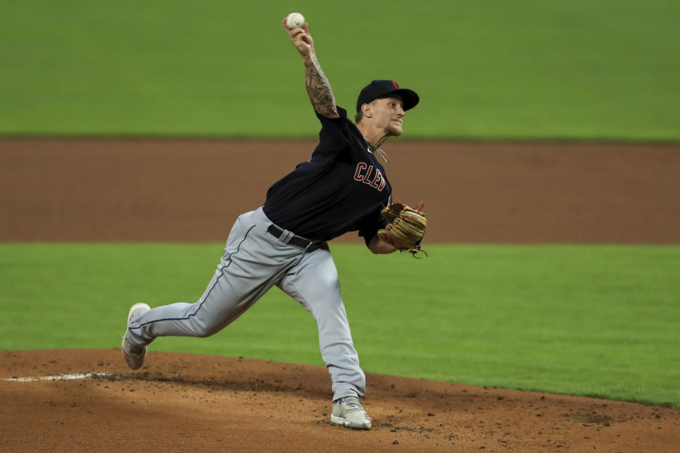 Cleveland Indians' Zach Plesac throws in the first inning during a baseball game against the Cincinnati Reds in Cincinnati, Monday, August 3, 2020. (AP Photo/Aaron Doster)