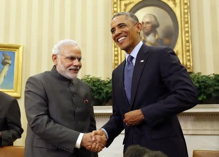 U.S. President Barack Obama shakes hands at a meeting with Prime Minister Narendra Modi in the Oval Office of the White House in Washington September 30, 2014. REUTERS/Larry Downing/Files