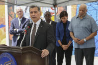 FILE - Xavier Becerra, Secretary of the Department of Health and Human Services, speaks at the podium during a press conference on the kickoff of 988, a new national mental health hotline, in West Philadelphia, July 15, 2022. The press conference took place in front of the Contemplation, Clarity and Resilience mural by artist Eric Okdeh, which is a mural that represents, among many other things, the process of overcoming hardships. (Heather Khalifa/The Philadelphia Inquirer via AP, File)