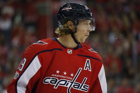 Oct 7, 2017; Washington, DC, USA; Washington Capitals center Nicklas Backstrom (19) spits on the ice during a stoppage in play in the first period against the Montreal Canadiens at Verizon Center. The Capitals won 6-1. Mandatory Credit: Amber Searls-USA TODAY Sports