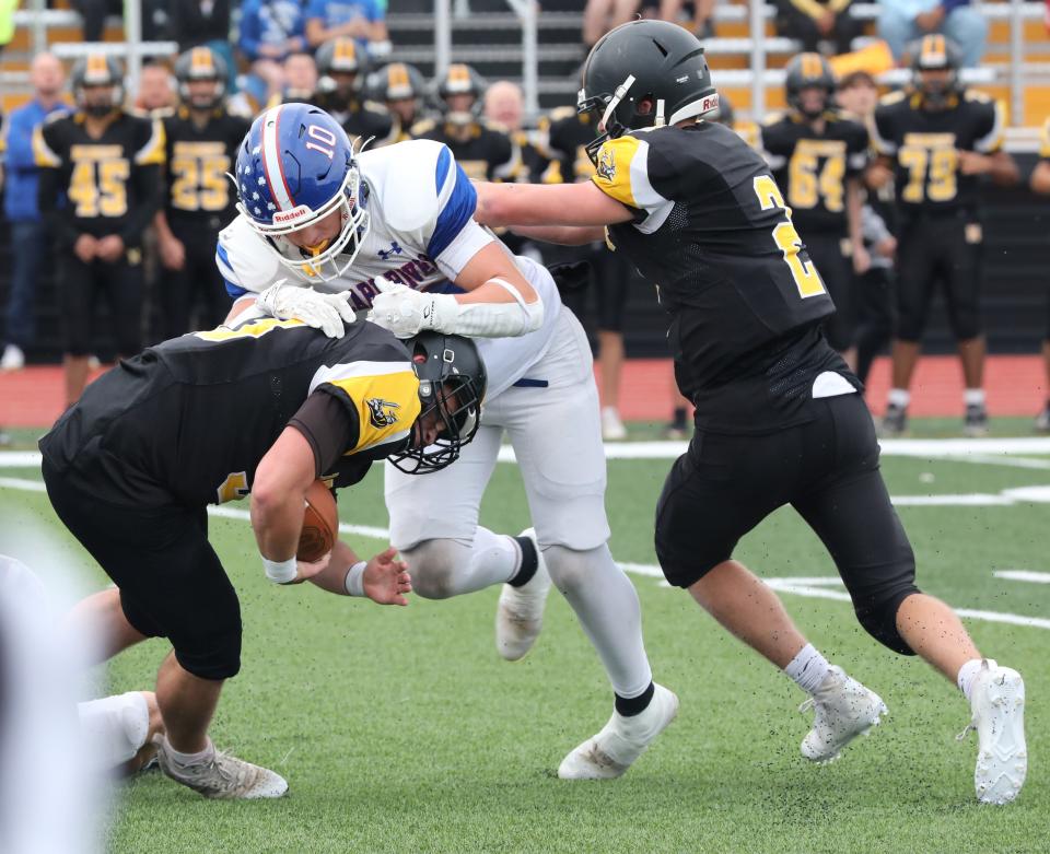 Nanuet ball carrier Evan Moran gets wrapped up by Pearl River's Anthony Graziano during the Nanuet vs. Pearl River football game at Nanuet High School, Oct. 21, 2023.