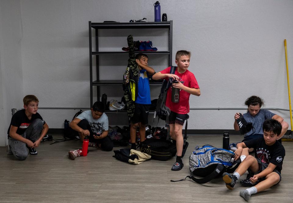 Casey Bittner, and his wrestling teammates all get ready to go home after a long practice inside the Daniel Cormier Wrestling Academy in Gilroy, Calif., on Tuesday  Nov. 23, 2021. 
