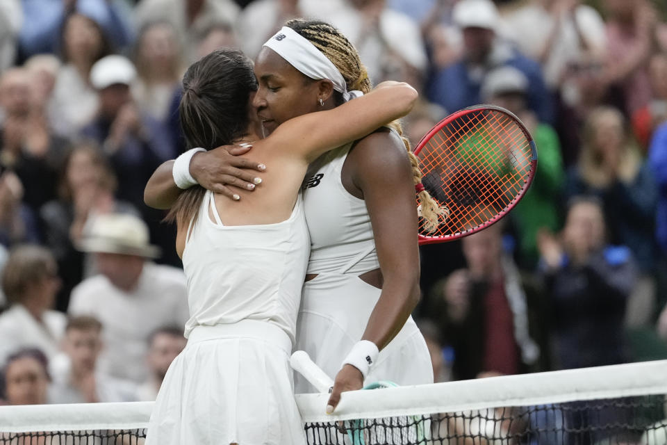 Emma Navarro, left, of the United States is congratulated by compatriot Coco Gauff following their fourth round match at the Wimbledon tennis championships in London, Sunday, July 7, 2024. (AP Photo/Alberto Pezzali)