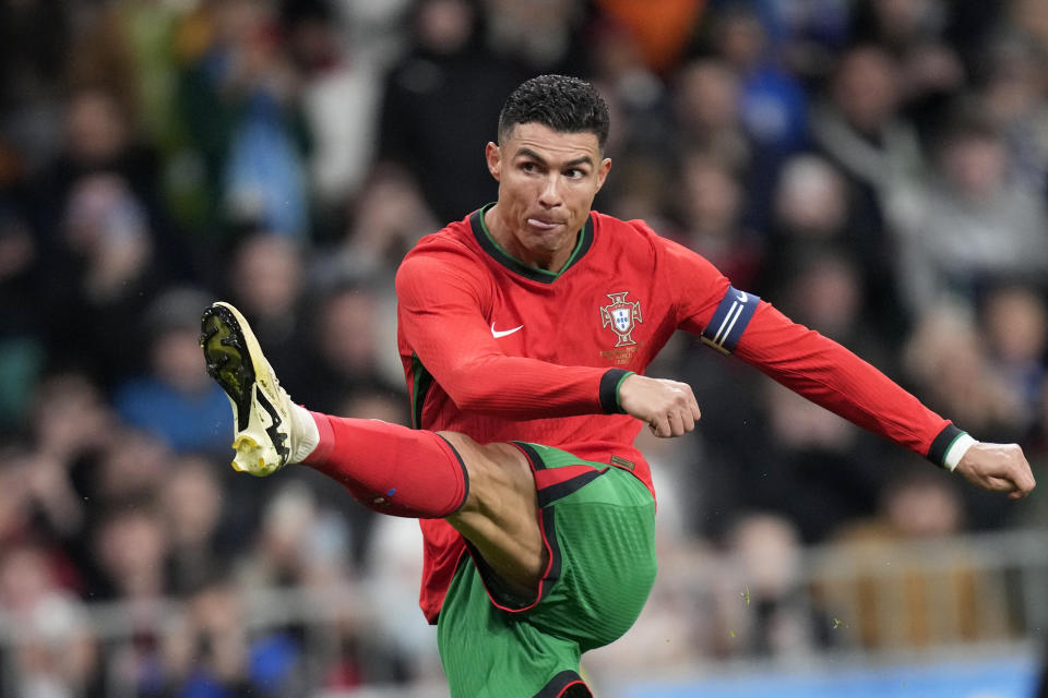 FILE - Portugal's Cristiano Ronaldo attempts a shot at goal during the international friendly soccer match between Slovenia and Portugal at the Stozice stadium in Ljubljana, Slovenia, Tuesday, March 26, 2024. The 24-team lineup is complete and all roads now lead to Germany for the European Championship. (AP Photo/Darko Bandic, File)