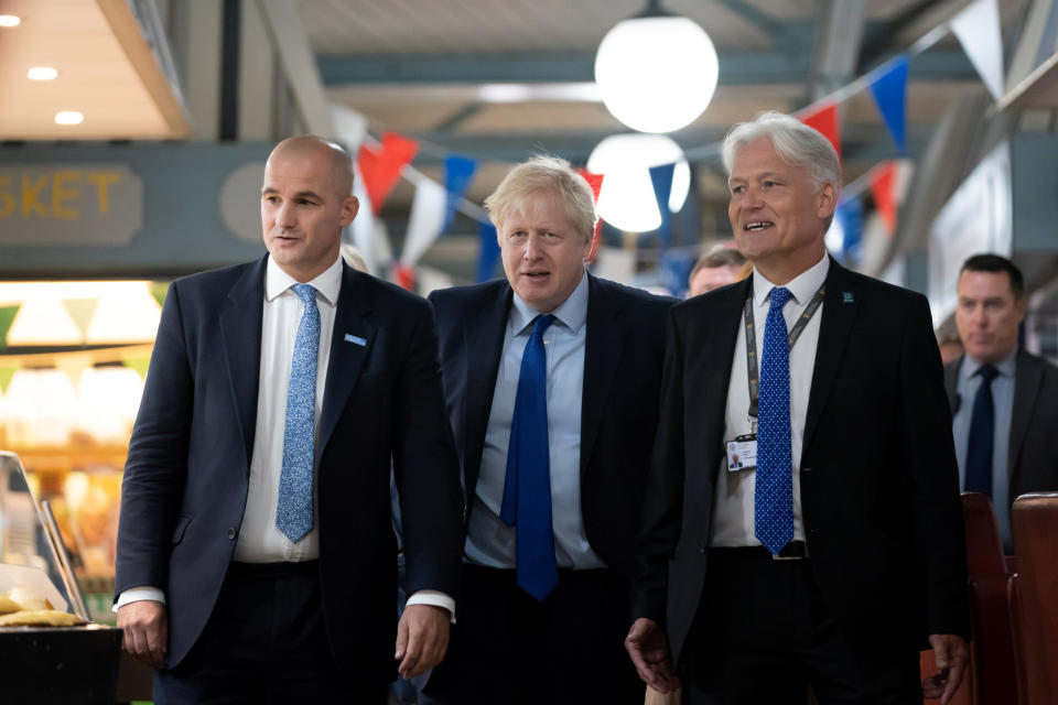 Boris Johnson walks with Northern Powerhouse minister Jake Berry and Doncaster Council chief executive Damian Allen