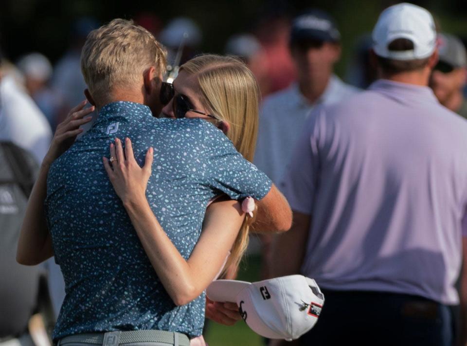 Will Zalatoris embraces his fiancé after winning his first PGA tournament during the last day of the FedEx St. Jude Championship at TPC Southwind in Memphis , Tenn., Sunday, Aug. 14, 2022.