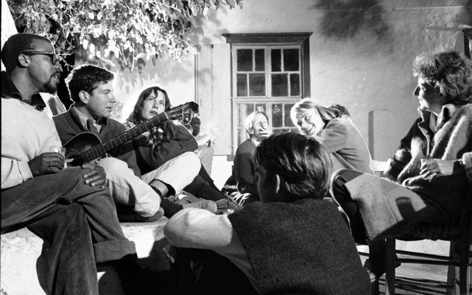 Cohen (2l) and Marianne (2r) in 1960, on the Greek island of Hydra - James Burke