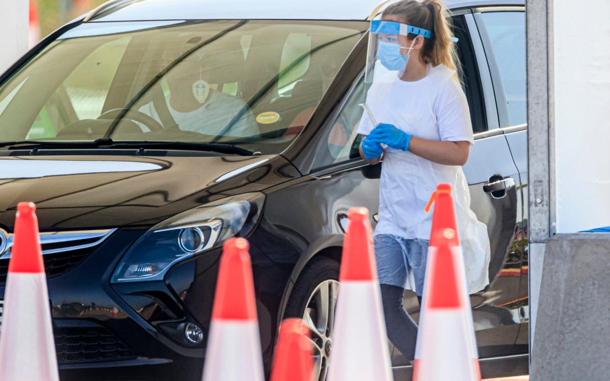 Samples are taken at a coronavirus testing facility in Temple Green Park and Ride, Leeds, as NHS Test and Trace - seen as key to easing the lockdown restrictions - is rolled out across England. PA Photo. Picture date: Thursday May 28, 2020. Under the plans, anyone with coronavirus symptoms will immediately self-isolate and book a test, preferably at a testing centre or, if necessary, for delivery to their home, and their household should start a 14-day isolation period too - Danny Lawson/PA Wire