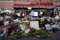 People gather at Cup Foods after a guilty verdict was announced at the trial of former Minneapolis police Officer Derek Chauvin for the 2020 death of George Floyd, Tuesday, April 20, 2021, in Minneapolis, Minn. Former Minneapolis police Officer Derek Chauvin has been convicted of murder and manslaughter in the death of Floyd. (AP Photo/Morry Gash)