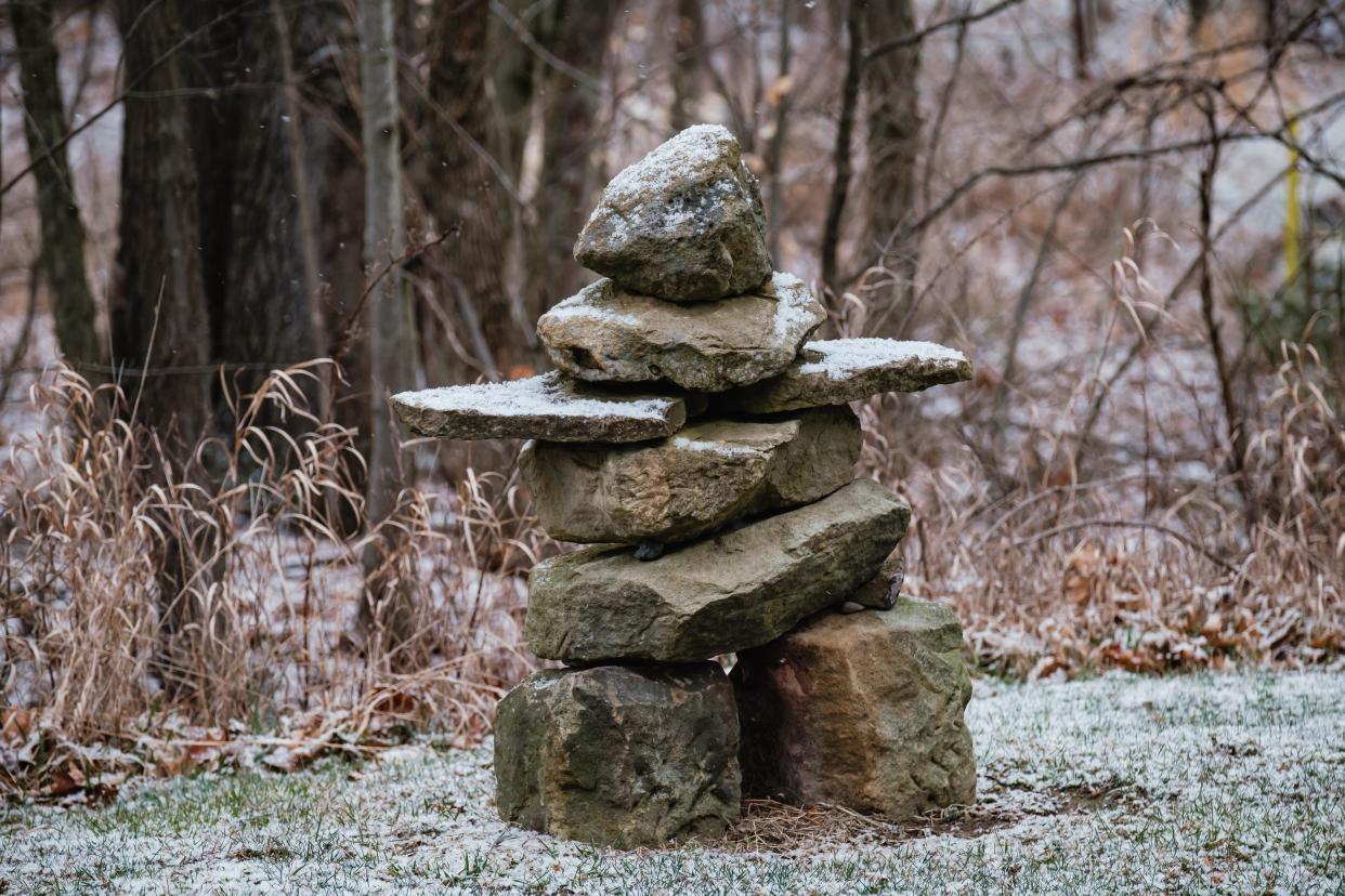 A driveway marker for a bed and breakfast in Lawrence Township is seen with accumulating snow last week.